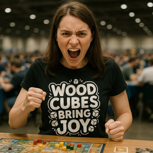 Lifestyle shot of the "Wood Cubes Bring Joy" black board game shirts in a real-world setting