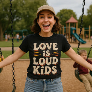 Lifestyle shot of the "Love Is Loud Kids" black family life t shirt in a real-world setting
