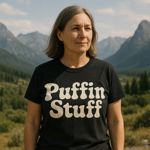 Lifestyle shot of the "Puffin Stuff" black birdwatching t shirt in a real-world setting