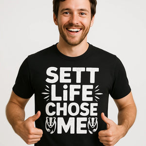 Close-up of the "Sett Life Chose Me" white print on a premium Bella+Canvas black badgers shirts