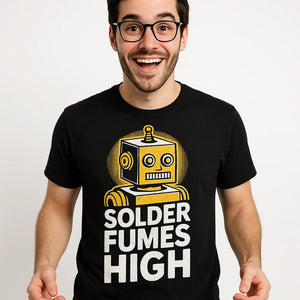 Close-up of the "Solder Fumes High" white print on a premium Bella+Canvas black robotic t shirt