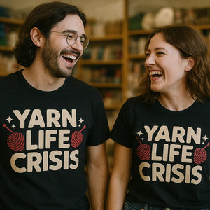 Person wearing the black knitted henley t shirt graphic tee - "Yarn Life Crisis" design