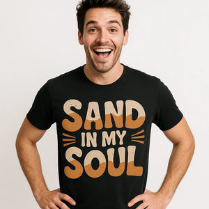 Close-up of the "Sand in My Soul" orange print on a premium Bella+Canvas black desert t shirt