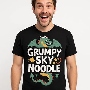 Close-up of the "Grumpy Sky Noodle" white print on a premium Bella+Canvas black shirts with dragons on them
