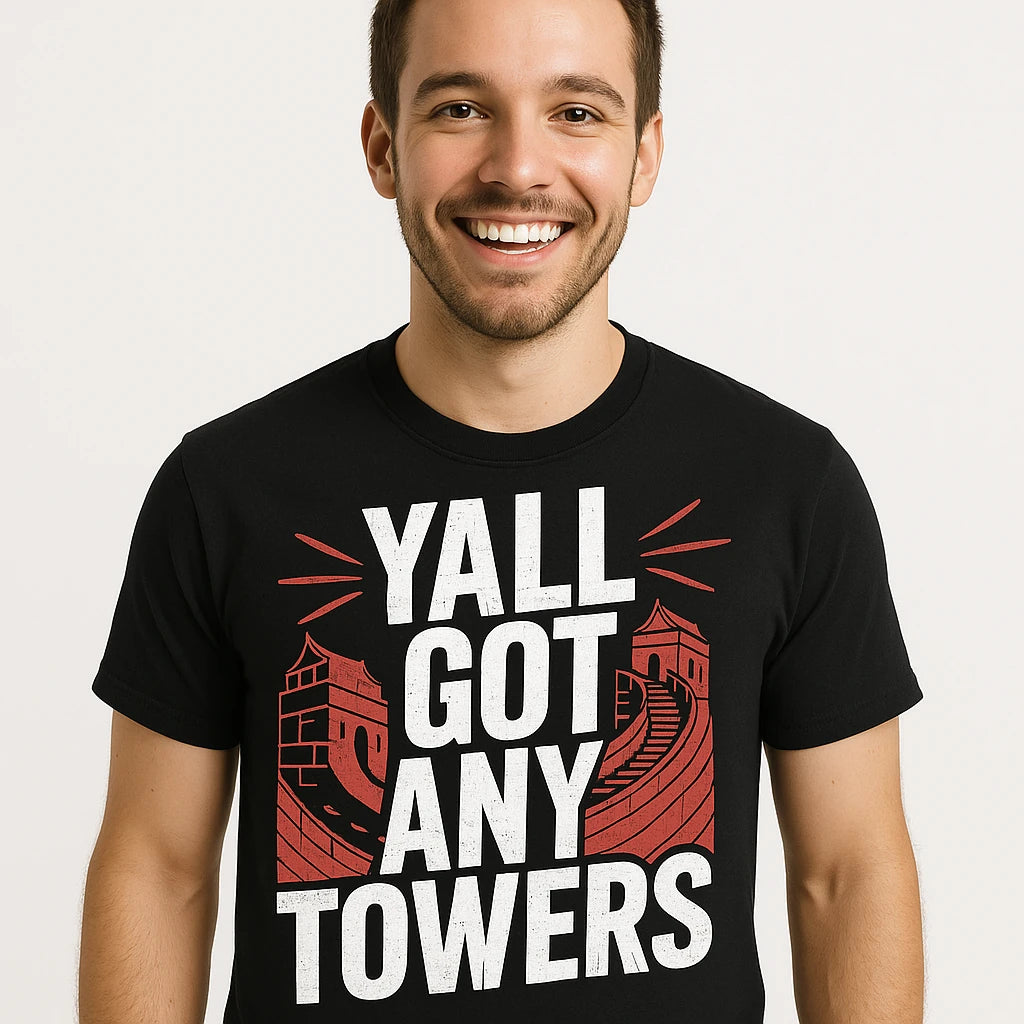 Close-up of the "Yall Got Any Towers" white print on a premium Bella+Canvas black china t shirt