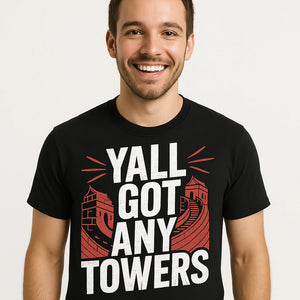 Close-up of the "Yall Got Any Towers" white print on a premium Bella+Canvas black china t shirt