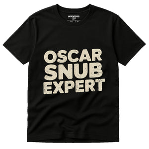 Black Graphic Tee - "Oscar Snub Expert" graphic tee with beige print, flat lay product photo