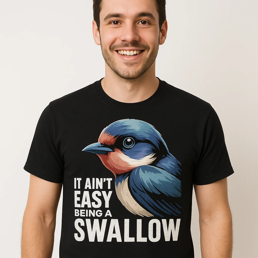 Close-up of the "It Ain'T Easy Being a Swallow" gray print on a premium Bella+Canvas black t shirt i swallow