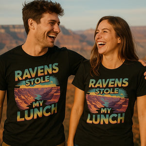 Person wearing the black i hiked the grand canyon t shirt graphic tee - "Ravens Stole My Lunch" design