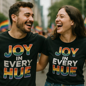 Person wearing the black lgbtq tee graphic tee - "Joy in Every Hue" design
