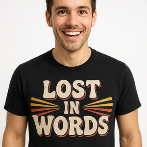 Close-up of the "Lost in Words" beige print on a premium Bella+Canvas black translator shirts