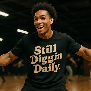 Lifestyle shot of the "Still Diggin Daily" black hip hop tee shirts in a real-world setting