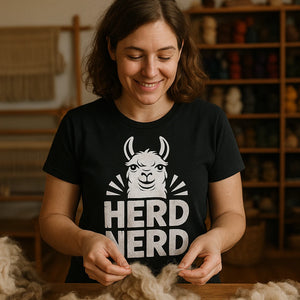 Lifestyle shot of the "Herd Nerd" black llama t shirt in a real-world setting