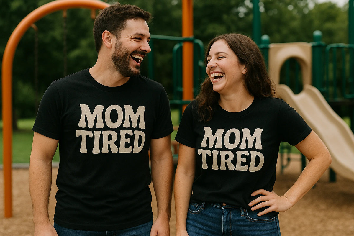Person wearing the black cute mom life shirts graphic tee - "Mom Tired" design