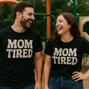 Person wearing the black cute mom life shirts graphic tee - "Mom Tired" design