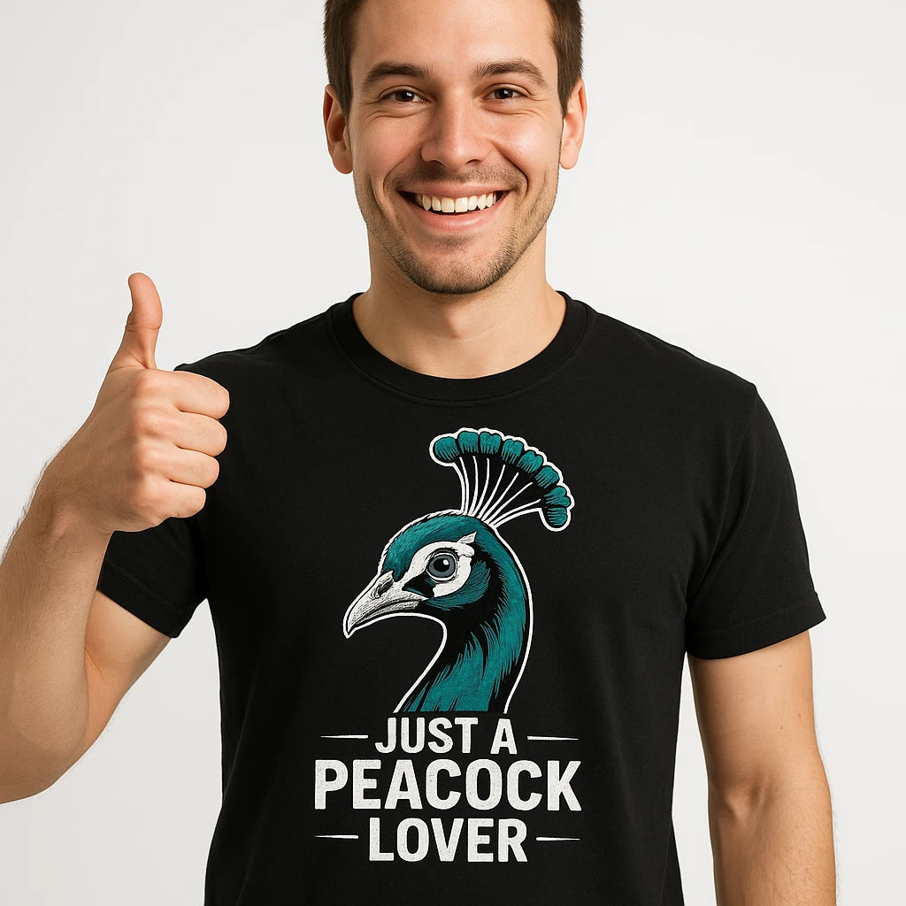 Close-up of the "Just a Peacock Lover" white print on a premium Bella+Canvas black peacocks shirts