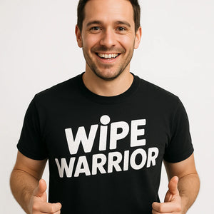 Close-up of the "Wipe Warrior" white print on a premium Bella+Canvas black diaper duty t shirt