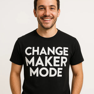 Close-up of the "Change Maker Mode" white print on a premium Bella+Canvas black activism t shirt
