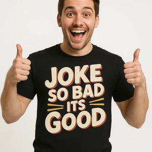 Close-up of the "Joke So Bad Its Good" beige print on a premium Bella+Canvas black comedy t shirt