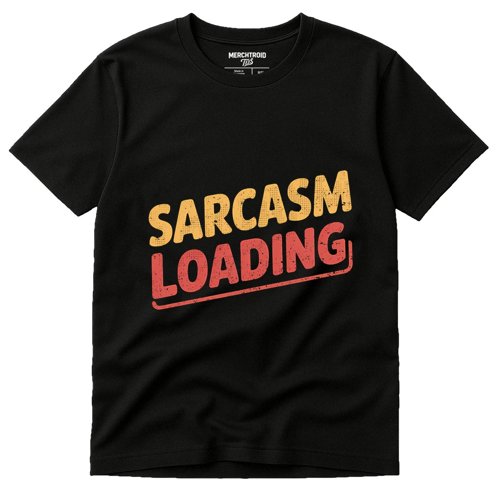 A black T-shirt with the text "Sarcasm Loading" printed on the front in bold, distressed font. The word "Sarcasm" is in yellow, and "Loading" is in red with an underline.