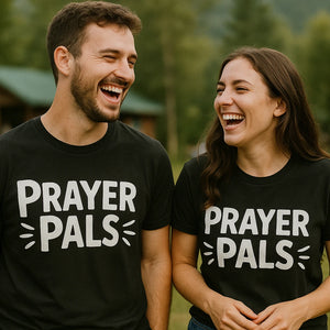 Person wearing the black love and faith tshirts graphic tee - "Prayer Pals" design