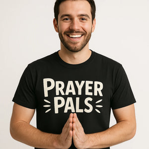 Close-up of the "Prayer Pals" white print on a premium Bella+Canvas black love and faith tshirts