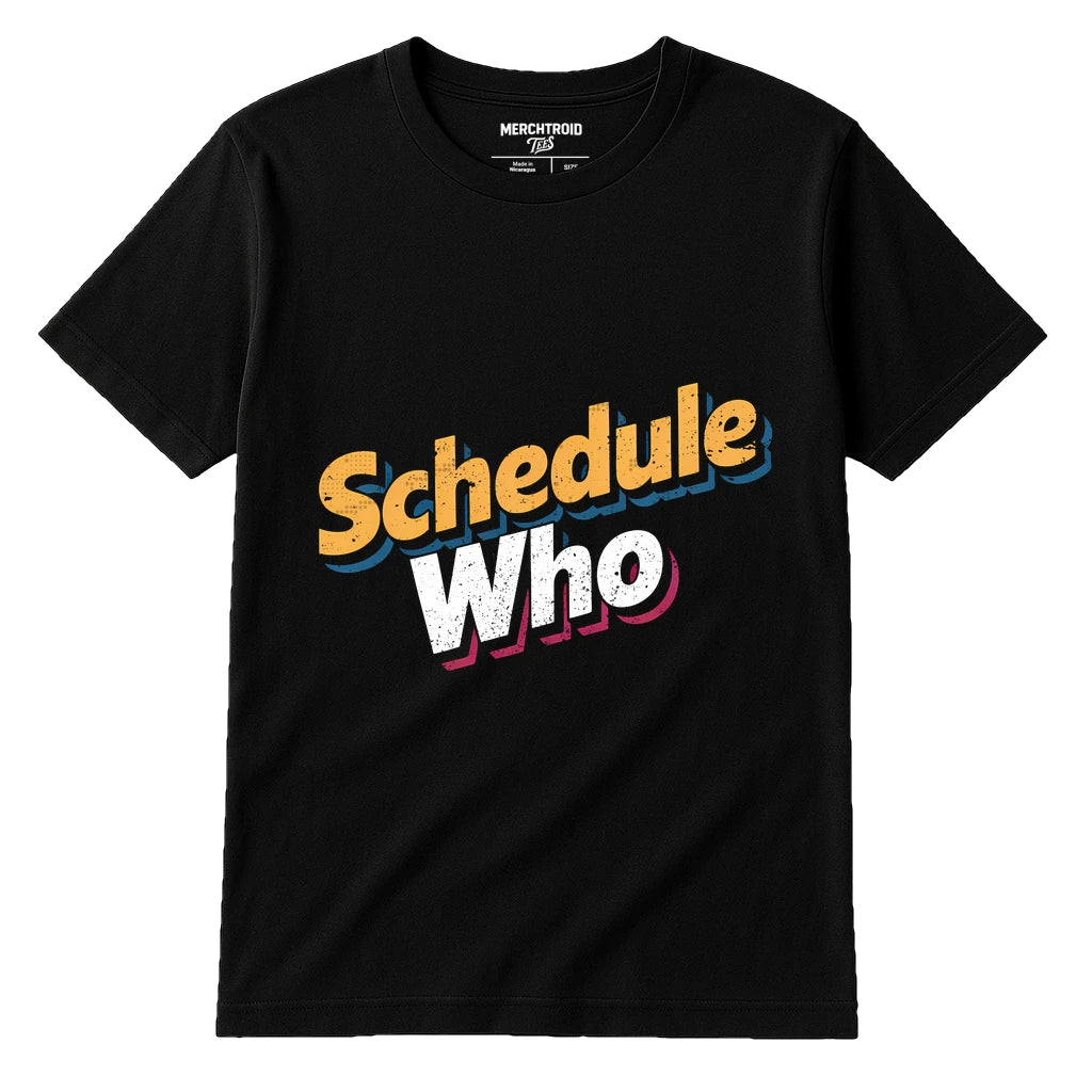 A black t-shirt with the text "Schedule Who" printed in large, colorful letters across the front. The word "Schedule" is in an orange font, and "Who" is in a white font with a pink outline. The shirt is laid flat against a white background, showing a simple and bold design.
