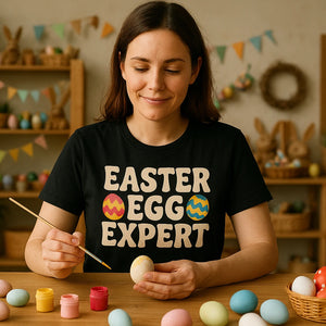 Lifestyle shot of the "Easter Egg Expert" black ladies easter shirts in a real-world setting