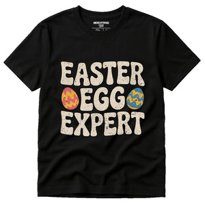 Black Ladies Easter Shirts - "Easter Egg Expert" graphic tee with beige print, flat lay product photo