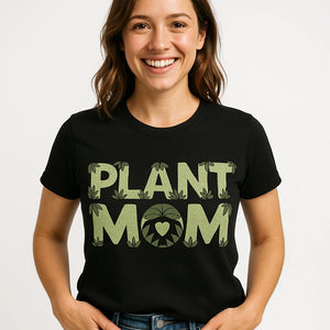 Close-up of the "Plant Mom" tan print on a premium Bella+Canvas black rainforest alliance t shirt