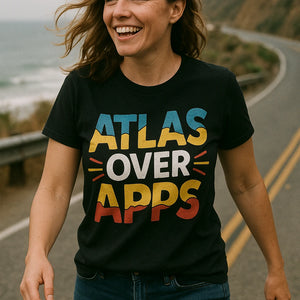 Close-up of the "Atlas Over Apps" gold print on a premium Bella+Canvas black road trippin t shirt