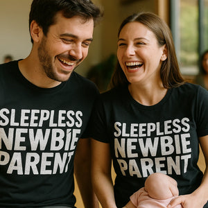 Person wearing the black new parents matching shirts graphic tee - "Sleepless Newbie Parent" design