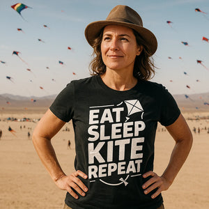 Lifestyle shot of the "Eat Sleep Kite Repeat" black kite flying t shirt in a real-world setting