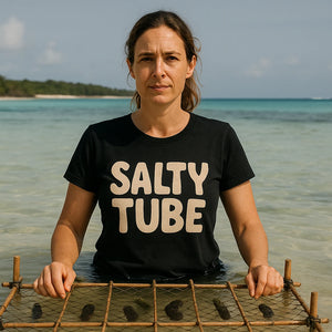 Lifestyle shot of the "Salty Tube" black cool as a cucumber t shirt in a real-world setting