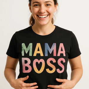 Close-up of the "Mama Boss" tan print on a premium Bella+Canvas black mom life tee shirt