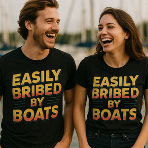 Person wearing the black t shirt boat neck graphic tee - "Easily Bribed By Boats" design