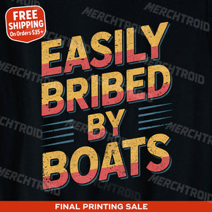 "Easily Bribed By Boats" black t shirt boat neck, photographed as gifts for boating lovers
