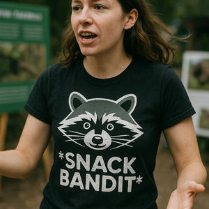 "Snack Bandit" black raccoon t shirt, photographed as gifts for raccoon lovers