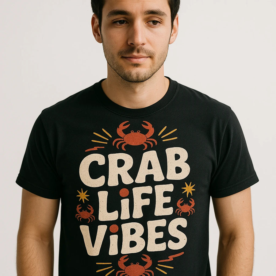 A person wearing a black t-shirt with the words "CRAB LIFE VIBES" printed on it, accompanied by illustrations of red crabs and decorative lines. The person has short dark hair and a neutral expression.