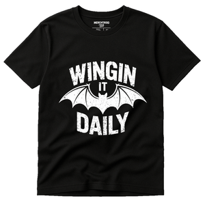 Black Batwing Tshirt - "Wingin It Daily" graphic tee with white print, flat lay product photo