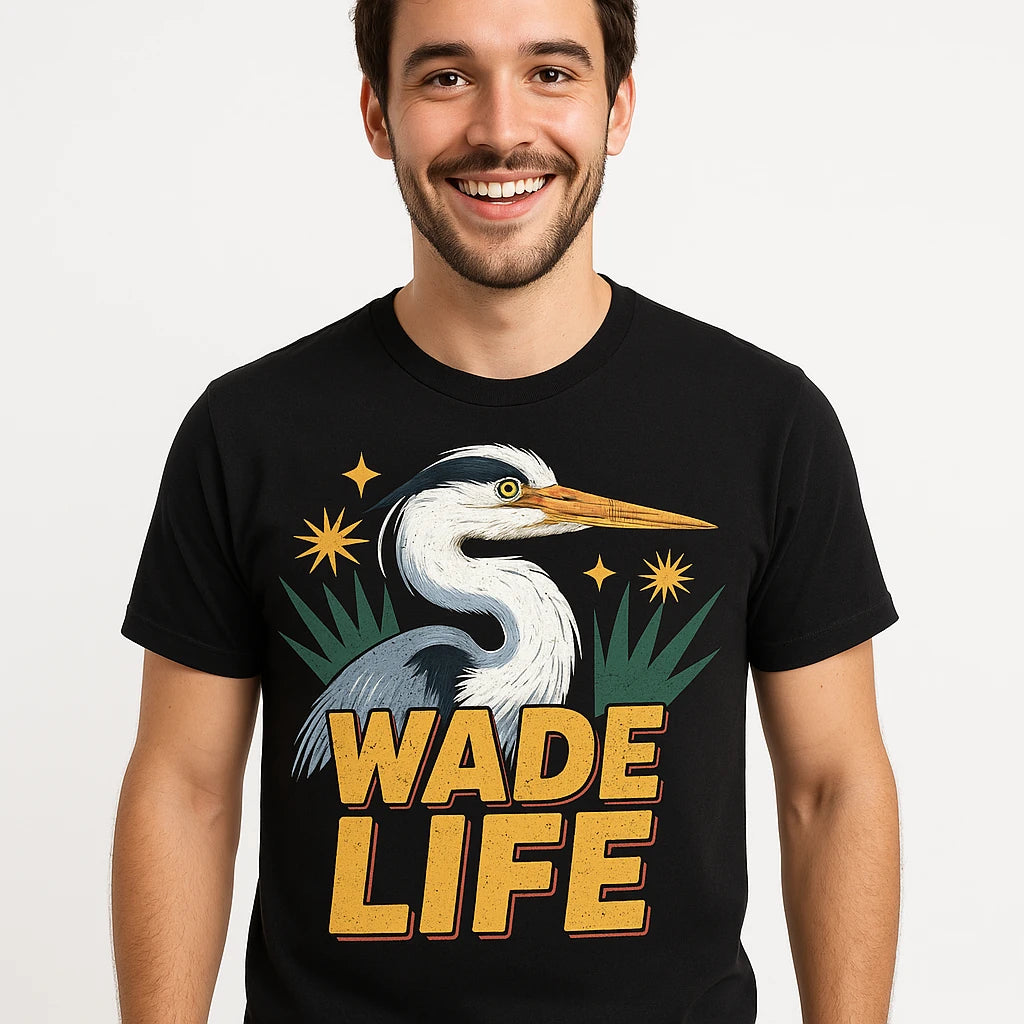 Close-up of the "Wade Life" gold print on a premium Bella+Canvas black heron shirts