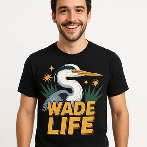 Close-up of the "Wade Life" gold print on a premium Bella+Canvas black heron shirts