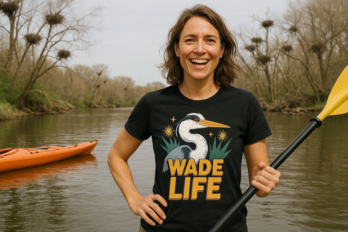 Lifestyle shot of the "Wade Life" black heron shirts in a real-world setting