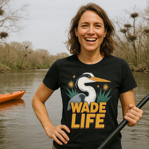 Lifestyle shot of the "Wade Life" black heron shirts in a real-world setting