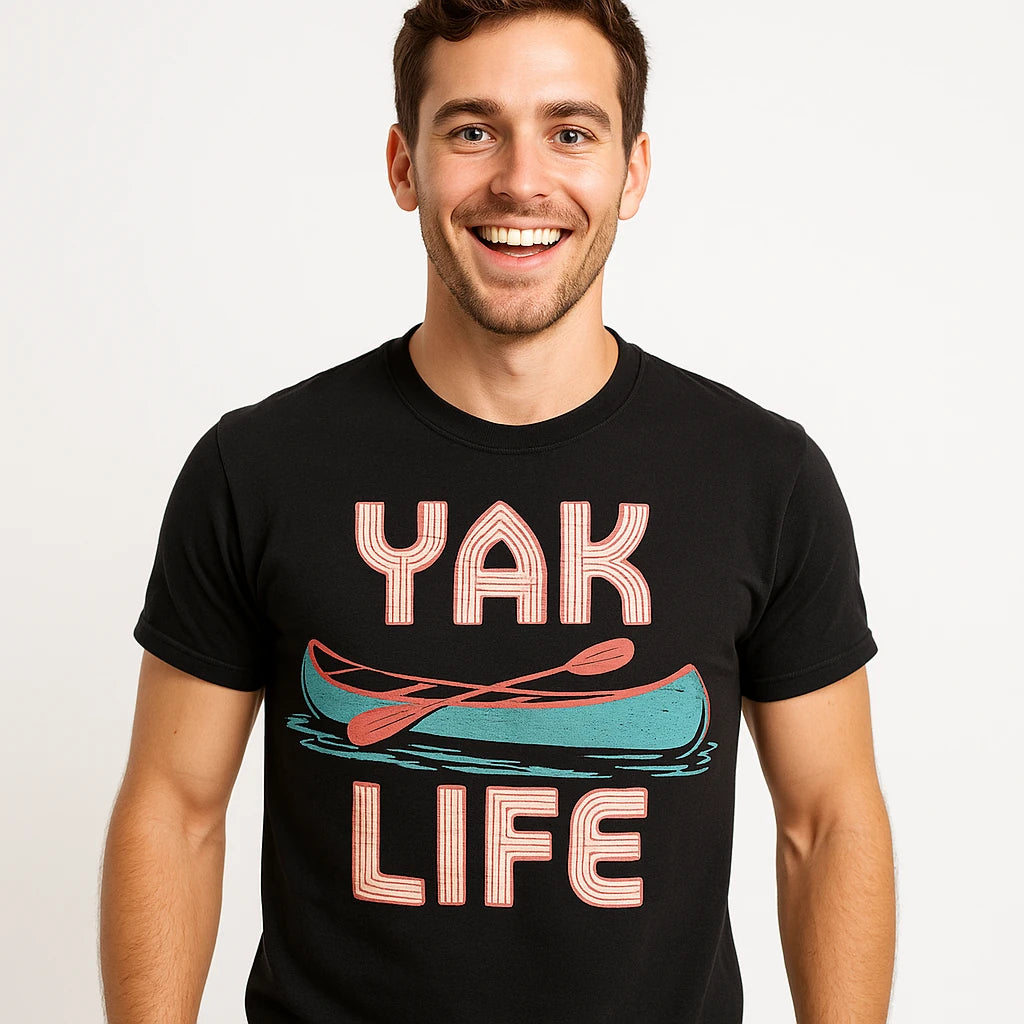 Close-up of the "Yak Life" beige print on a premium Bella+Canvas black canoeing t shirt