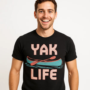 Close-up of the "Yak Life" beige print on a premium Bella+Canvas black canoeing t shirt