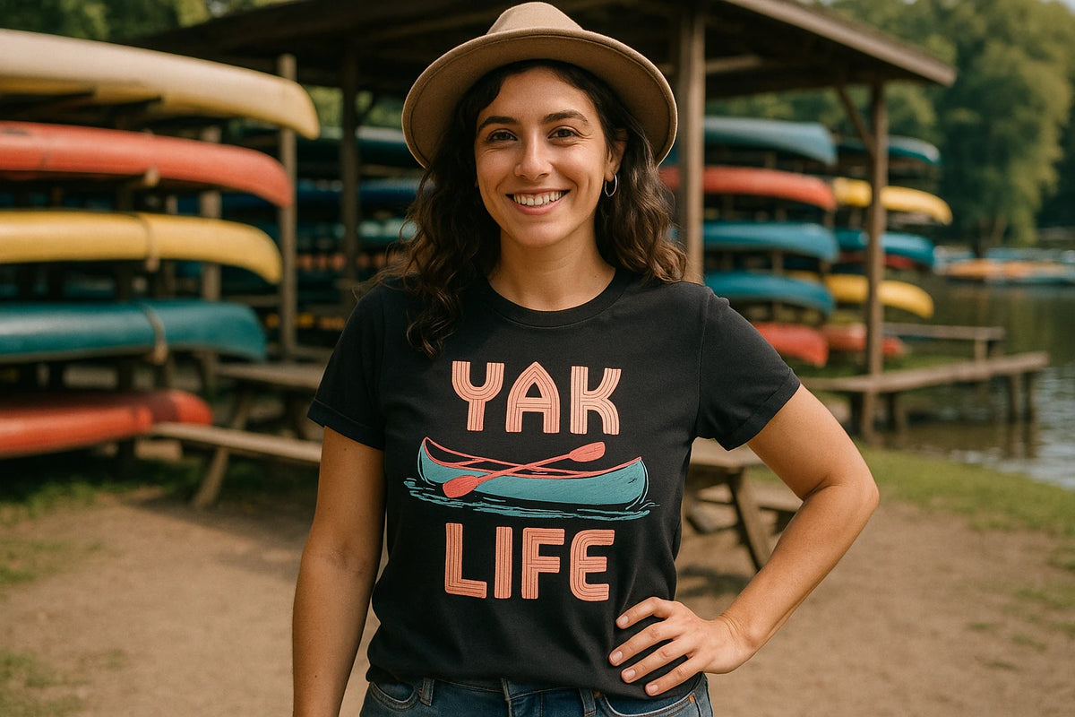 Lifestyle shot of the "Yak Life" black canoeing t shirt in a real-world setting