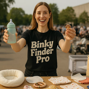 Lifestyle shot of the "Binky Finder Pro" black baby gear chaos t shirt in a real-world setting