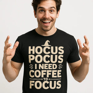 Close-up of the "Hocus Pocus I Need Coffee To Focus" beige print on a premium Bella+Canvas black witch t shirt
