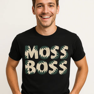 Close-up of the "Moss Boss" beige print on a premium Bella+Canvas black hoh rainforest t shirt